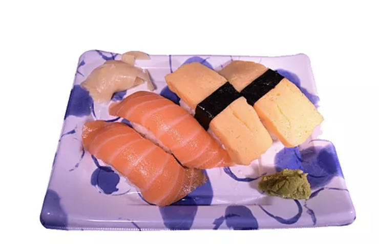 Serve your sushi to customers with a Sunshine Supply Company purple patterned sushi plate at your restaurant.