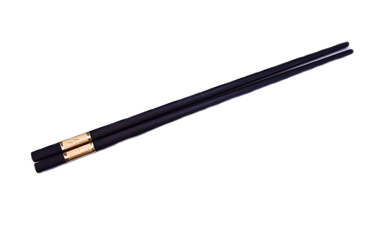 Provide customers with dining utensils such as these golden hook decorated chopsticks from Sunshine Supply Company.